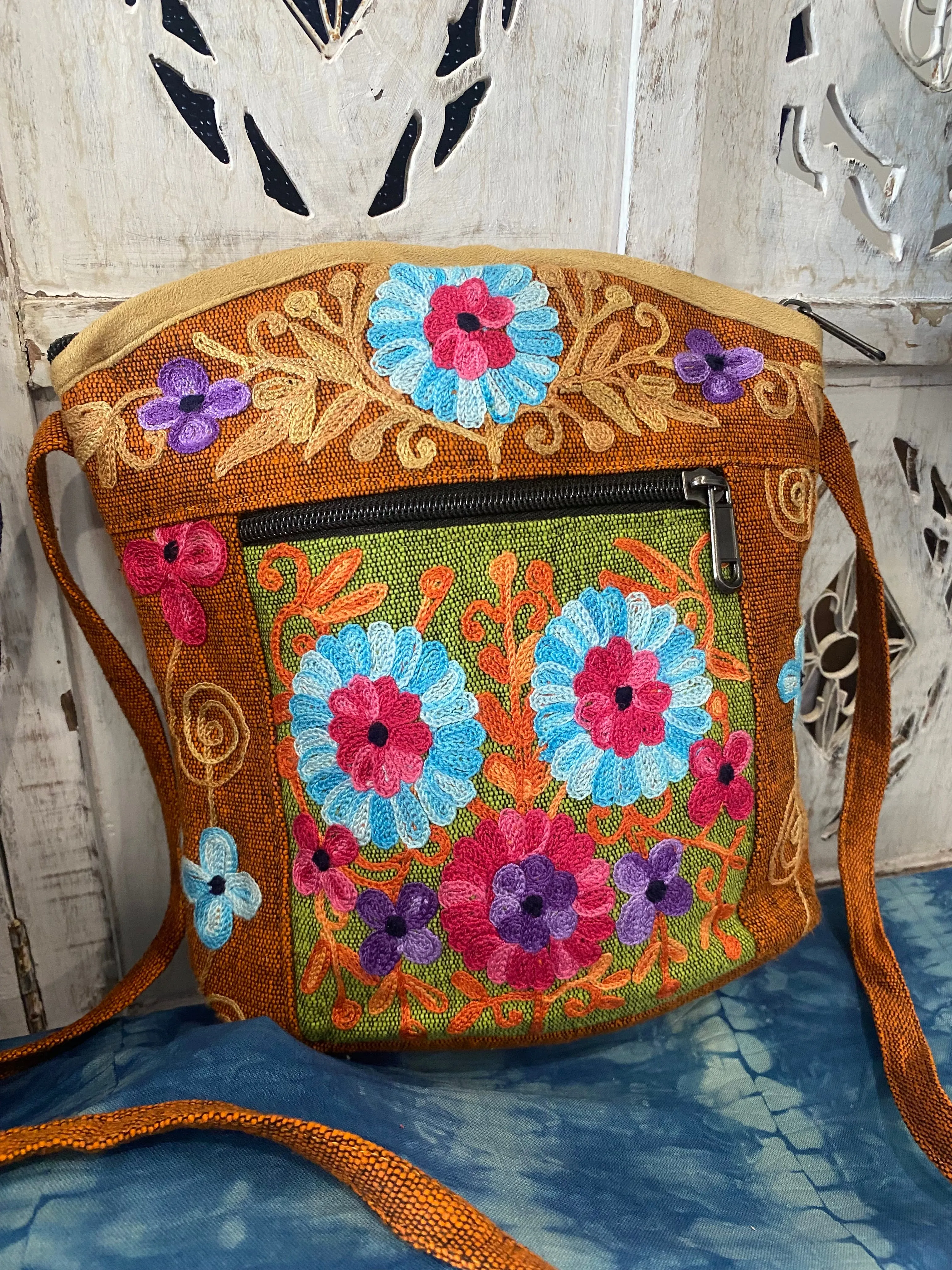 LWH Embroided Round Top Flower Handbag with shoulder strap.